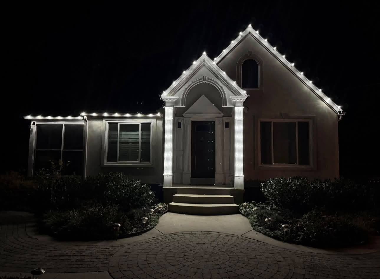 Small home with crisp white architectural lighting